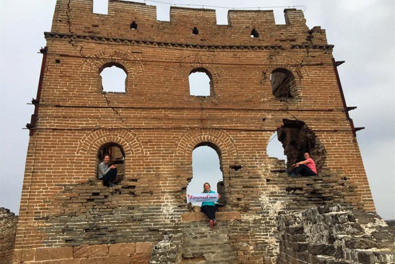 Three women hike Jinshanling Great Wall of China
