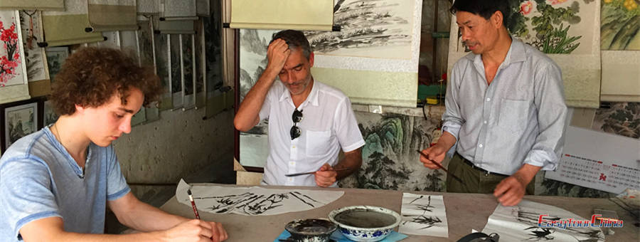 Paris father and son living in Shanghai take a painting class in Yangshuo