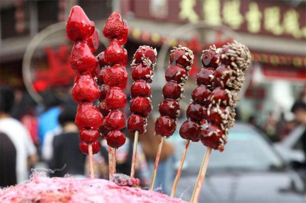 Traditional Chinese New Year Desserts - a stick of sugar-coated haws