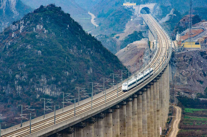 Take a fantastic train journey in China - train traverse mountains