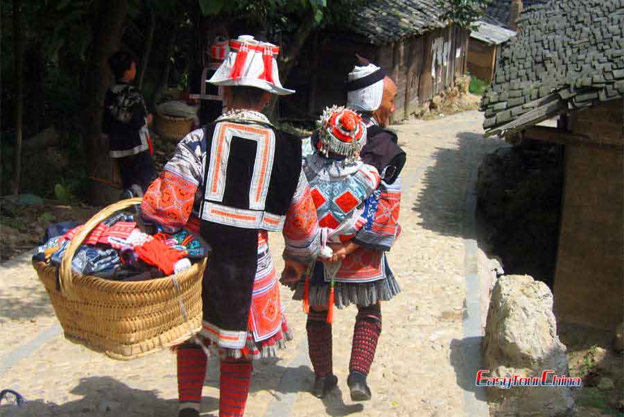 See gejia ladies dressed in colorful traditional costumes