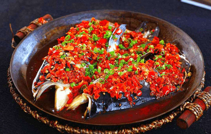 steamed fish head with diced hot red peppers is one of the most popular Chinese dishes