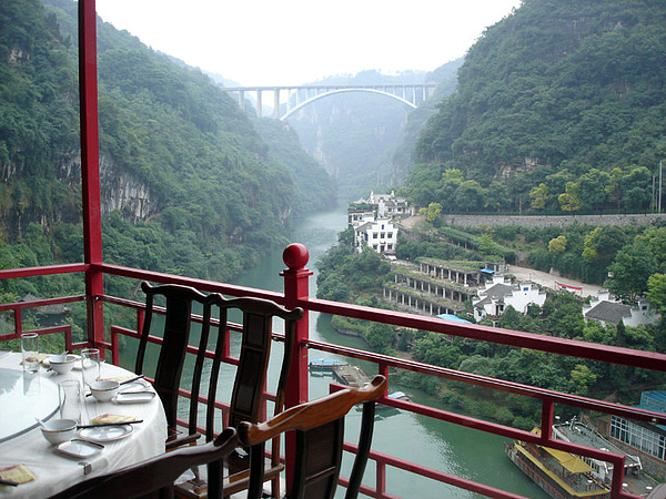 Part of the dining hall hangs out of the cave