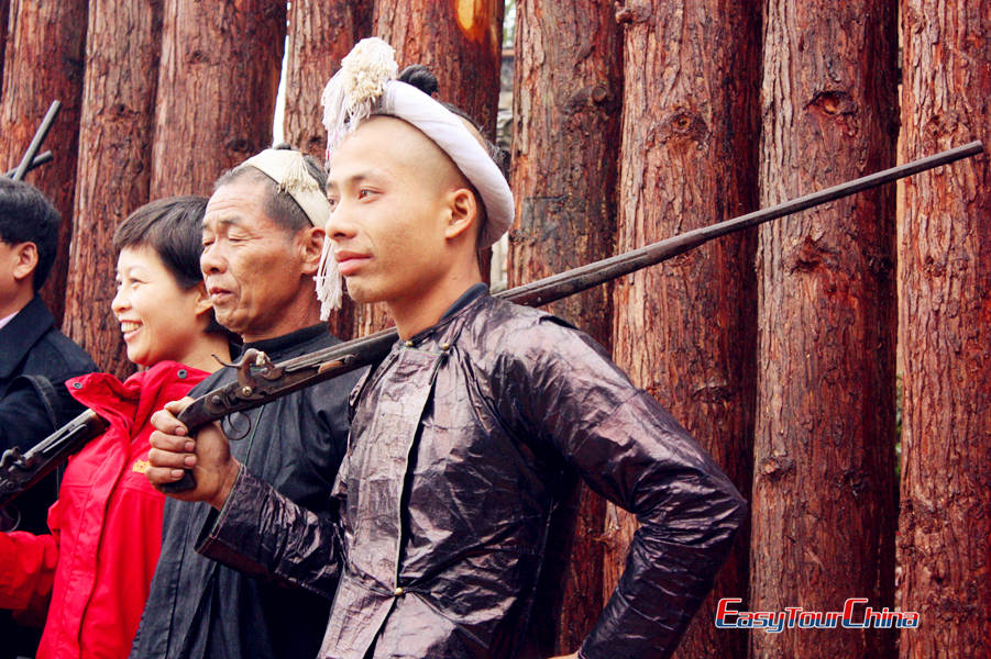 The local men with guns in Basha Miao Village
