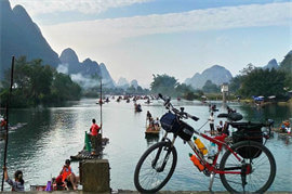 Biking along Guilin Li River Karst Mountains