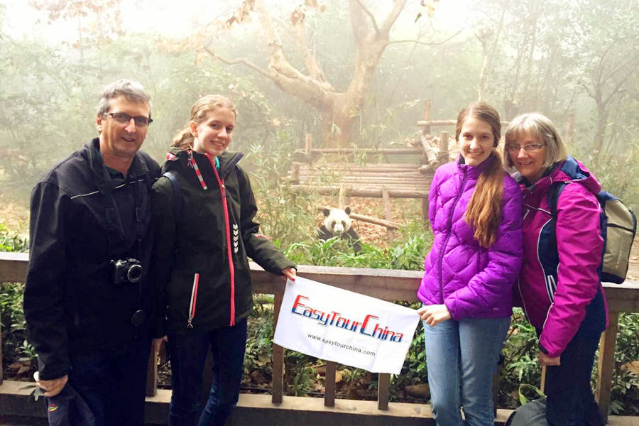 A family from USA visit the panda base in Chengdu