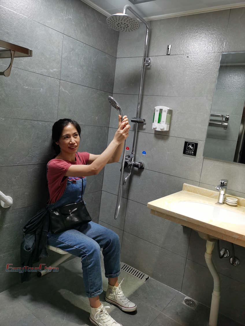 Silvia of Easy Tour China team perfom at the accessible hotel shower