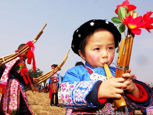 Miao boy Playing Lusheng