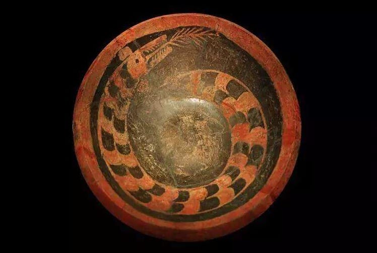 painted-pottery-plate-with-dragon-design