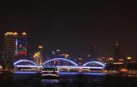 Evening cruise on Pearl River Architecture Covered in Colorful Lights