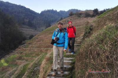 German couple tour China and hike Longji Rice Terraces in winter