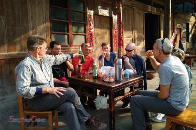 Uk traveleres dine at a local home in Guilin