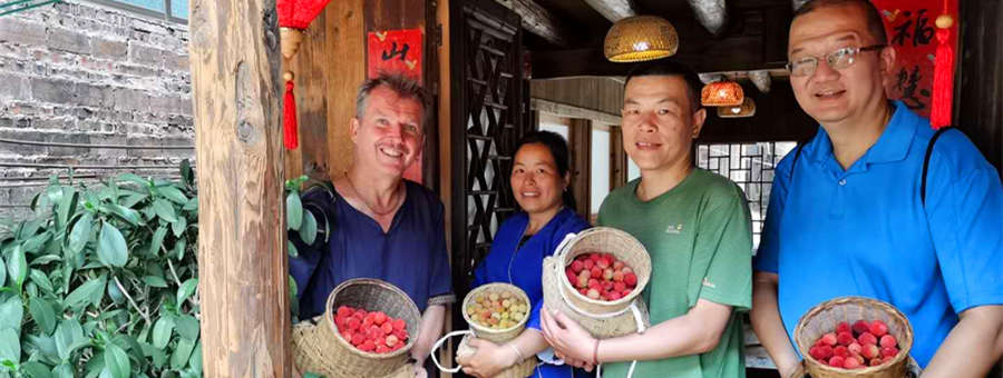 Wei, Ian, James show the sour plum they pick