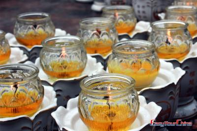 Burning candles at Emei Mountain