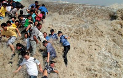People knocked down by Qiantang River Tide (Wave)