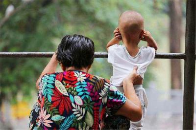 grandma take care of grand child after retirement in China