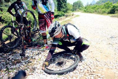 Robert Repairing a Bicycle Tyre for a Client