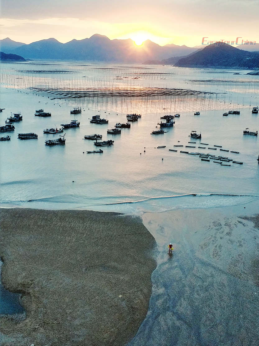 Take photo of fisherman working at Mudflats of Xiapu