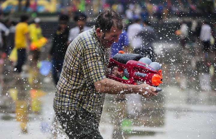 Tourist at Yunnan New Year Water Splahing Festival