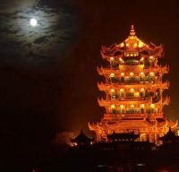 yellow crane tower at night