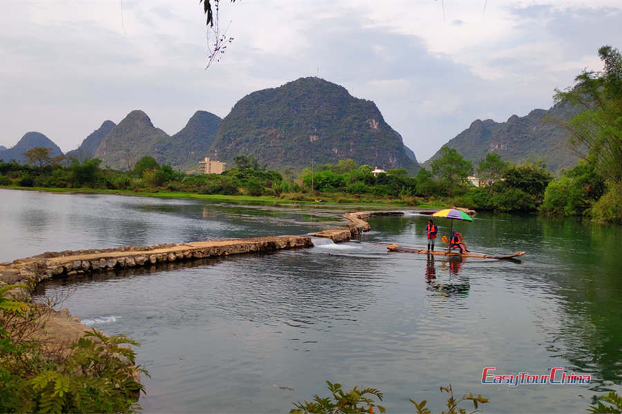Enjoy bamboo rafting down Yulong River in Yangshuo