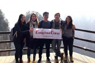 A group of students visit the Tianemen Mountain on a Zhangajijie trip